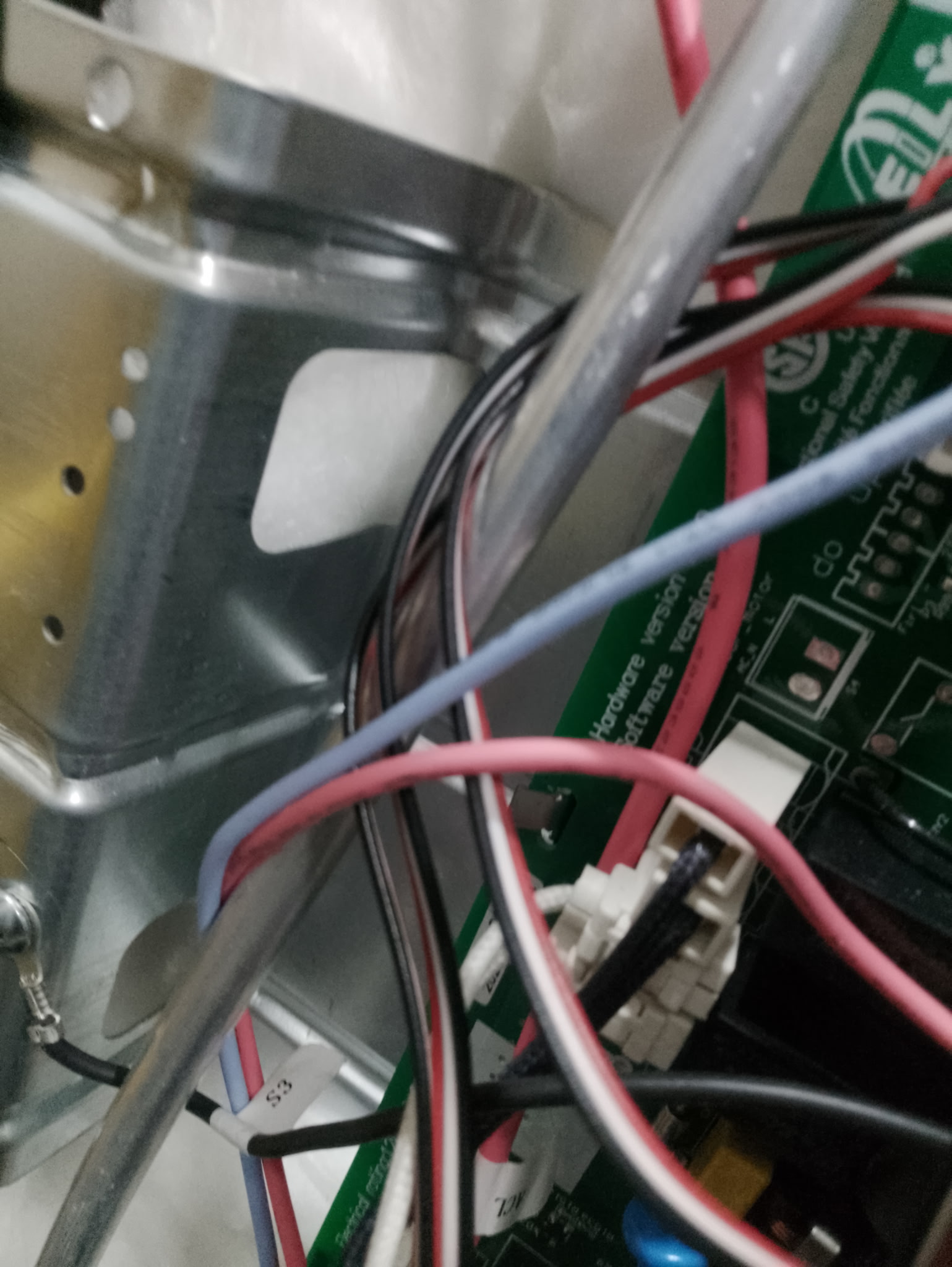 Washer control board and wiring harness during a Proven Masters repair